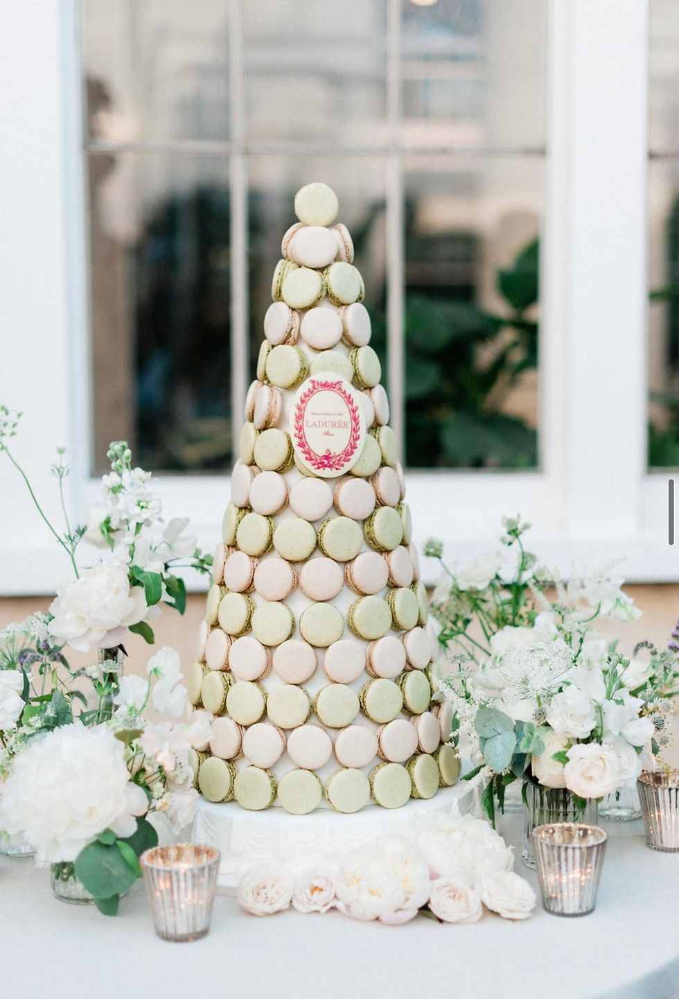 Close-up view of a beautifully arranged macaron tower at a wedding