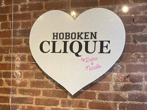 Customized Hoboken Clique, layered vinyl boutique store sign, with hybrid, individually cut lettering, designed, fabricated and installed by Skyline Graphic Management in Hoboken New Jersey