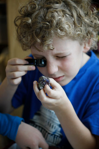 Student examining mineral