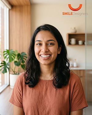 Smiling young woman at home with a confident, even smile, Smile Designers Dentistry