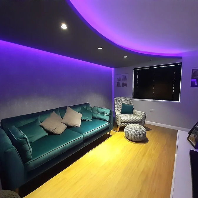 Cinema room interior with large green interior and purple lighting