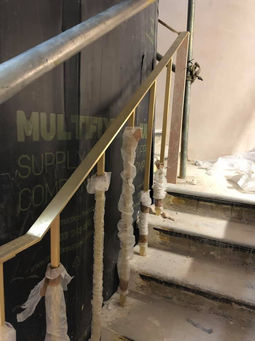Brass handrail on stairs