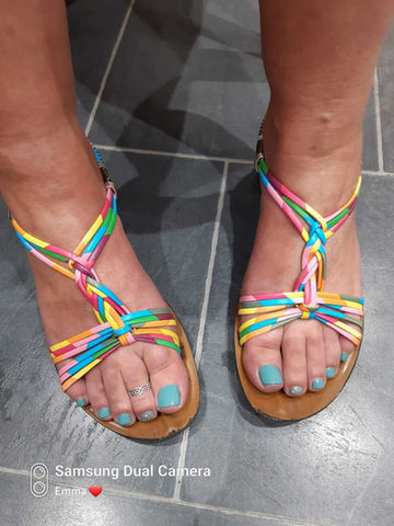 Woman's feet with blue gel polish
