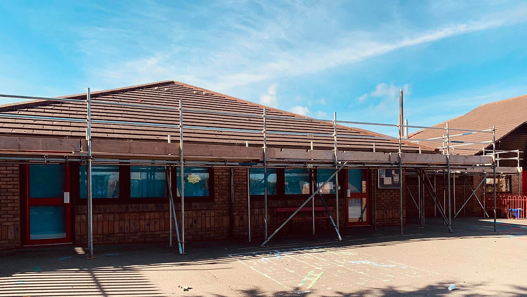 Commercial building roof with scaffolding erected