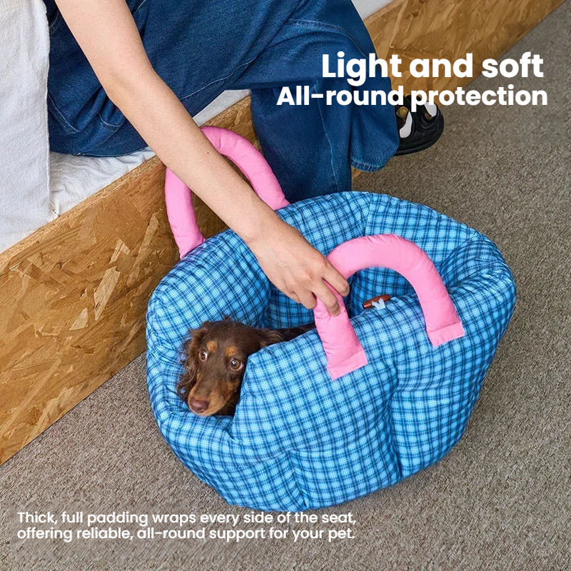 Thumbnail: Lightweight blue gingham dog carrier bed with pink handles, small puppy lying inside for all-around soft protection