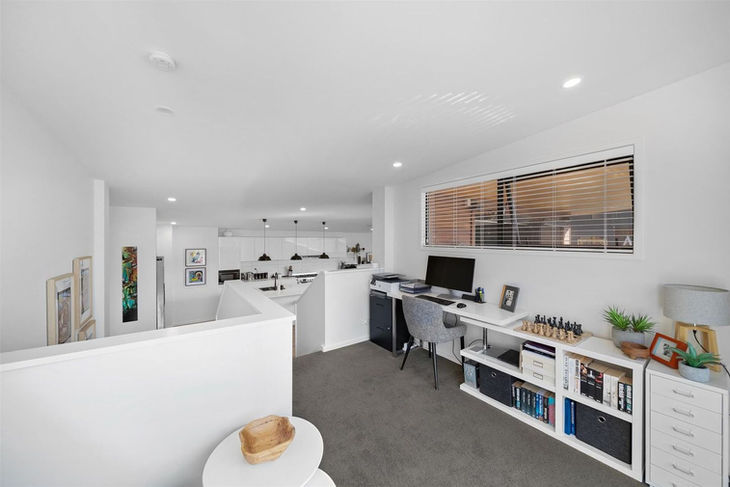 a home office with a desk and a computer