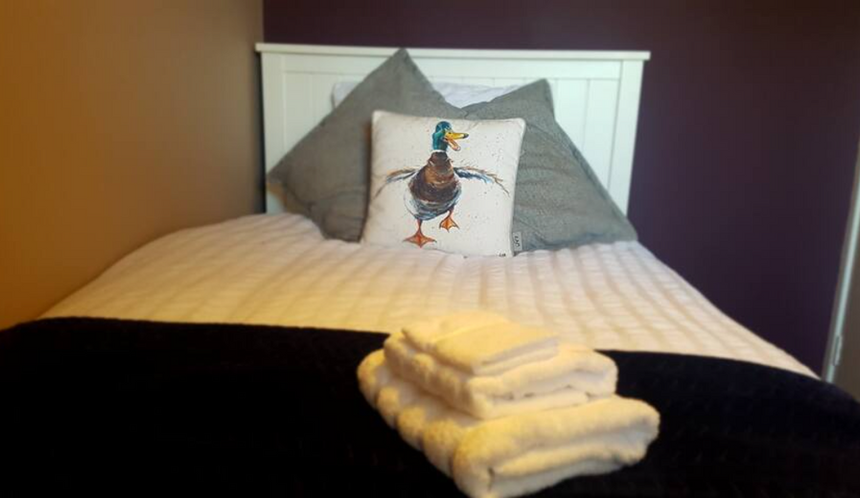 Bedroom 2 in this student accommodation - is located on the first floor overlooking the front garden. Decorated last year with a burgundy feature wall and IKEA white furniture.
