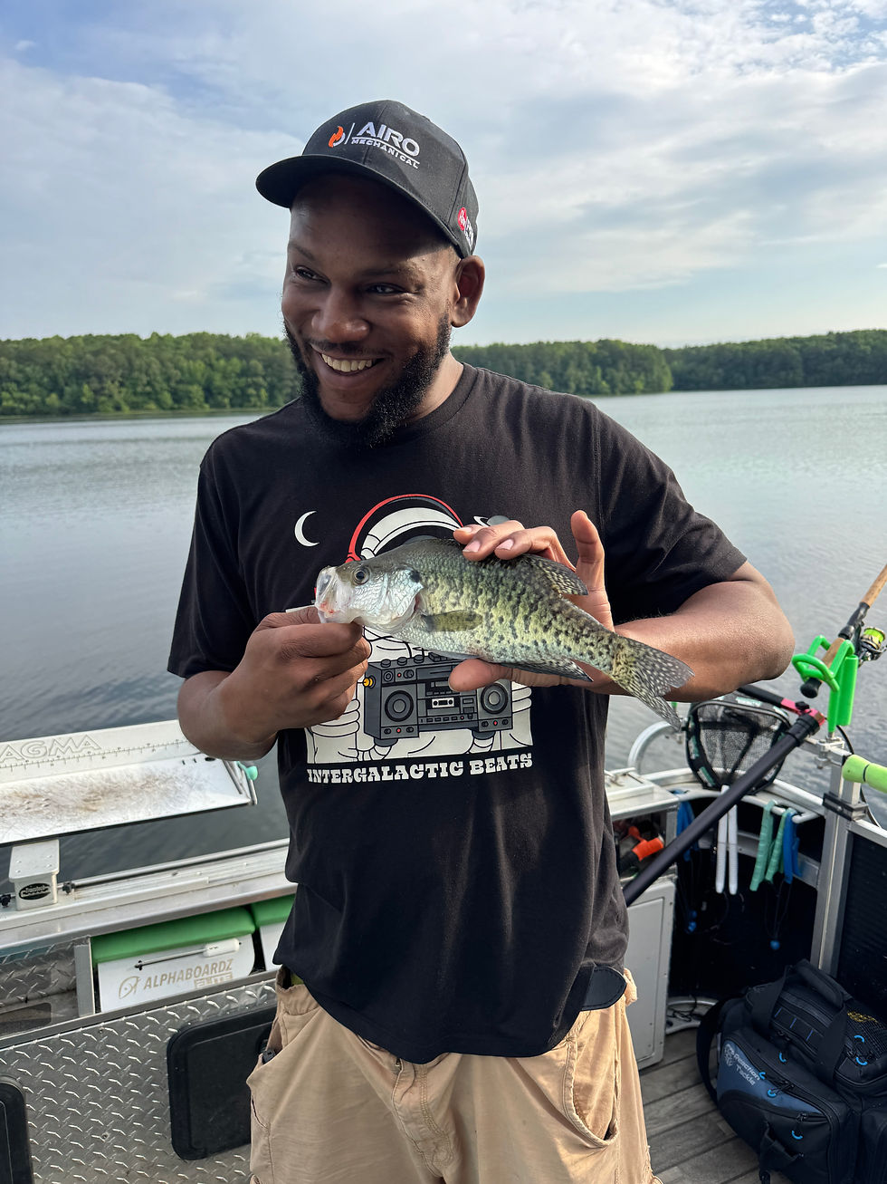 Guest holding large crappie that was caught while fishing lake chesdin with goober time guide service