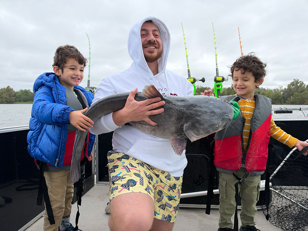 Anglers holding trophy blue catfish caught with Goober Time Guide Service while on the James River.