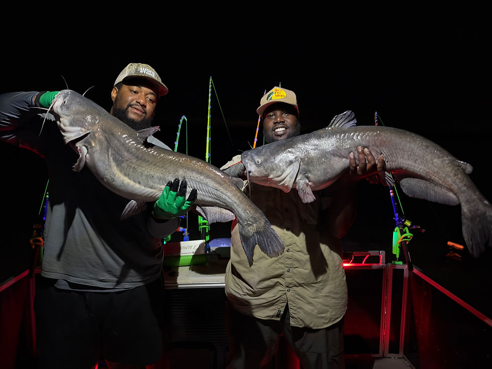 Anglers holding big blue catfish caught on the James River with Goober Time Guide Service