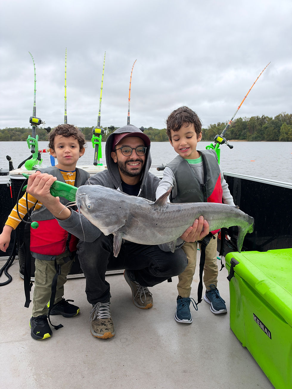 Family holding 15 lb blue catfish caught with Goober Time Guide Service while on the James River.
