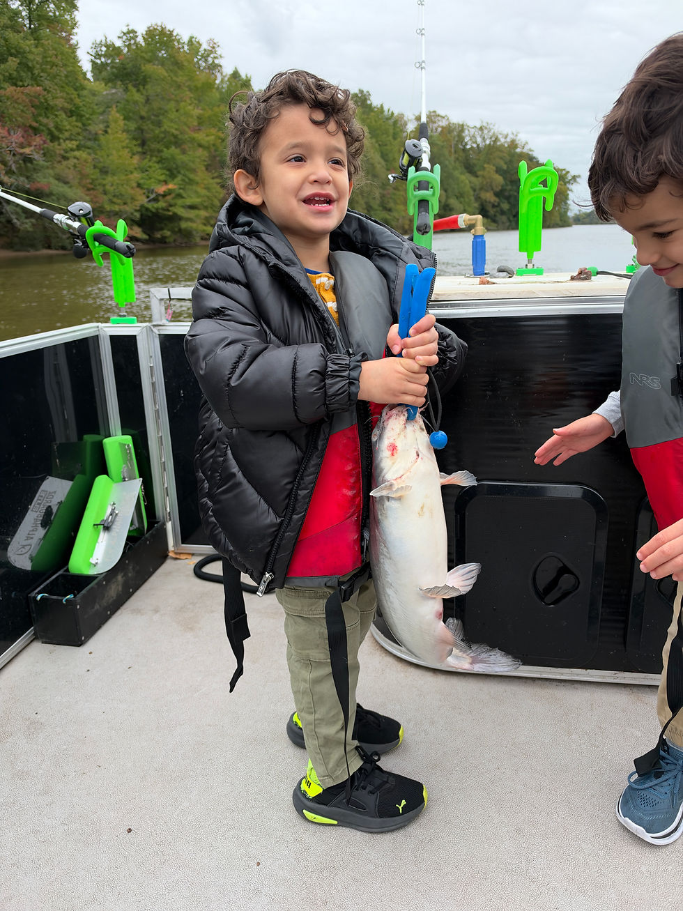 Young angler showing off blue catfish caught with Goober Time Guide Service while on the James River.