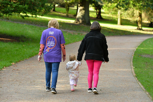 Volunteer, mum and child taking a walk