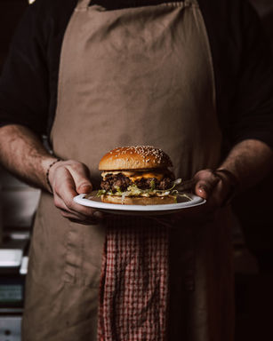 Chef holding burger