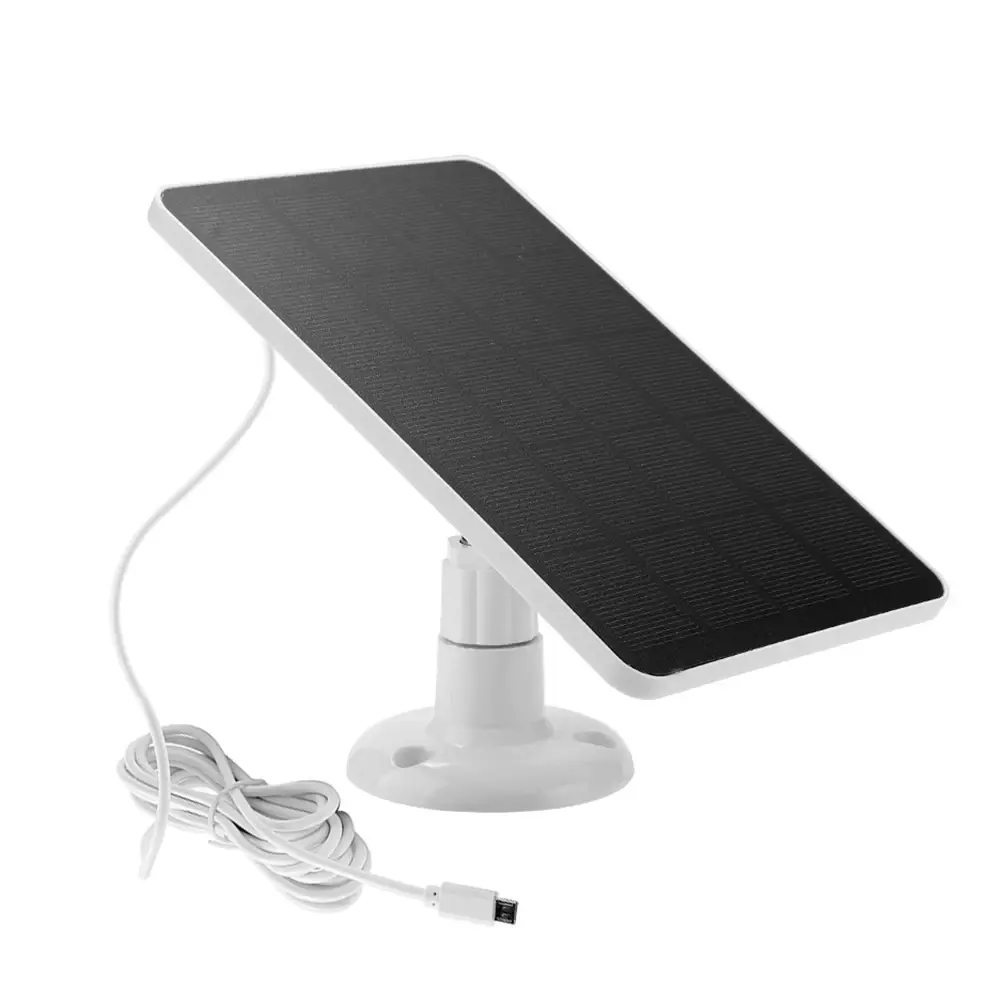 Solar battery charger set up in a backyard, efficiently charging a security camera