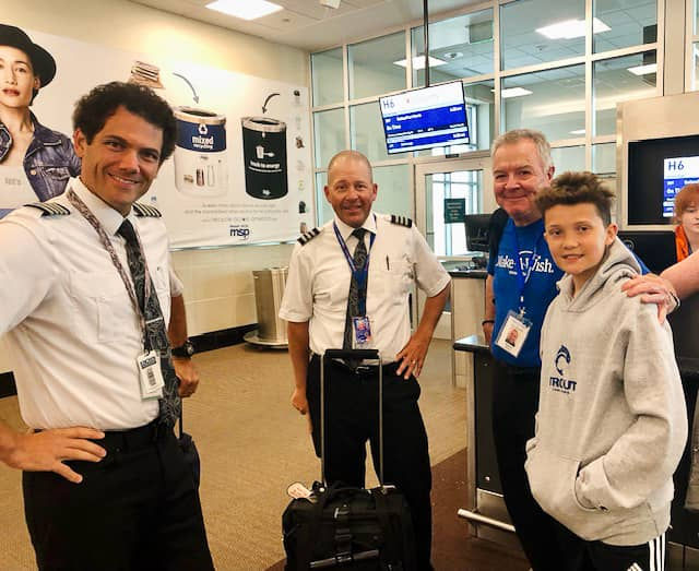 Sun Country Airlines pilots and Make-A-Wish recipient Neil Torbensen at airport