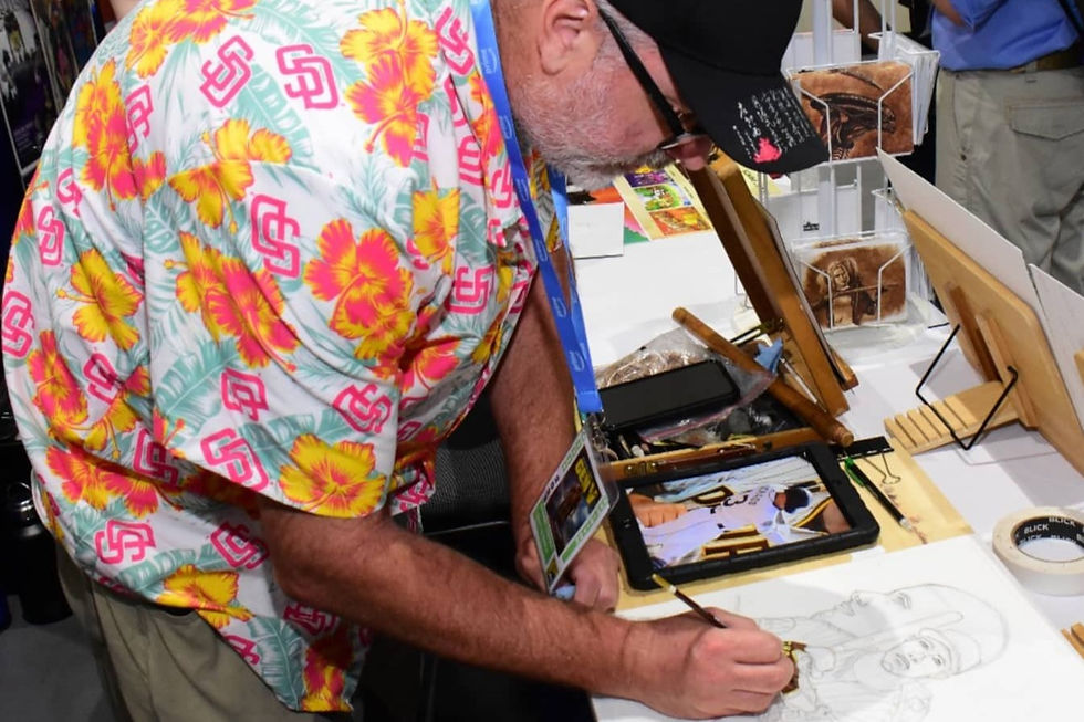 Man drawing picture at Comic Con