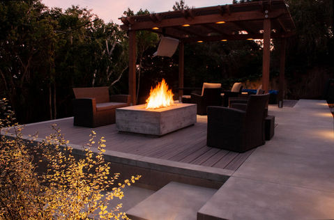 backyard hillside entertainment area with concrete steps, composite trex deck, custom fire pit make from concrete, Pergola with lighting and landscape