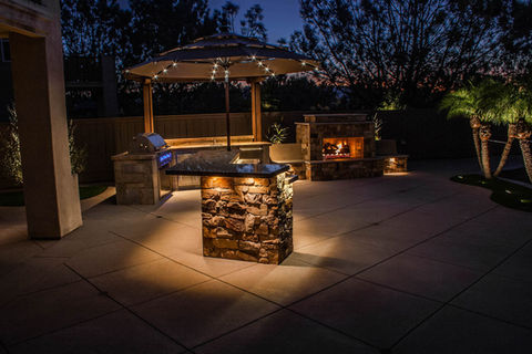 faux fireplace, outdoor living space, luxury backyard entertainment with BBQ Grill, Sink, Fridge, Stone Veneer, Granite Counters and Decorative Concrete