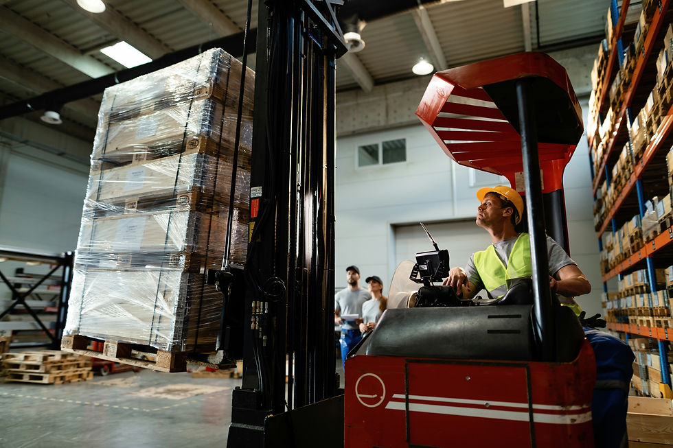 Electric forklift lifting pallets of goods in a modern warehouse