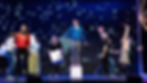 Actors performing a scene from The Curious Incident of the Dog in the Night-Time on stage