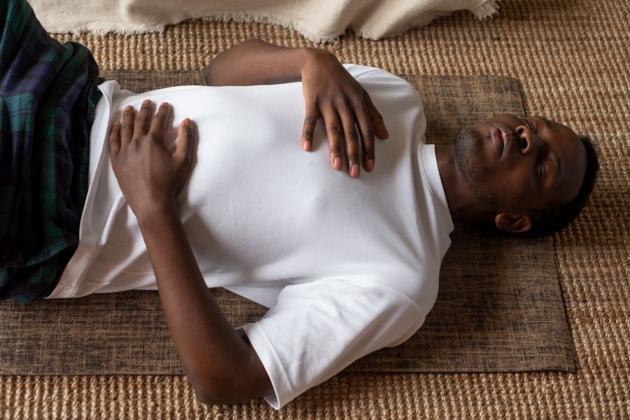 Guided supine breathing exercise with hands on chest and abdomen