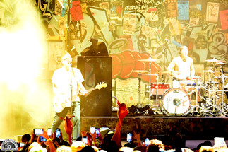 Blink-182 performing live on stage at Ruoff Music Center on 9/17/25