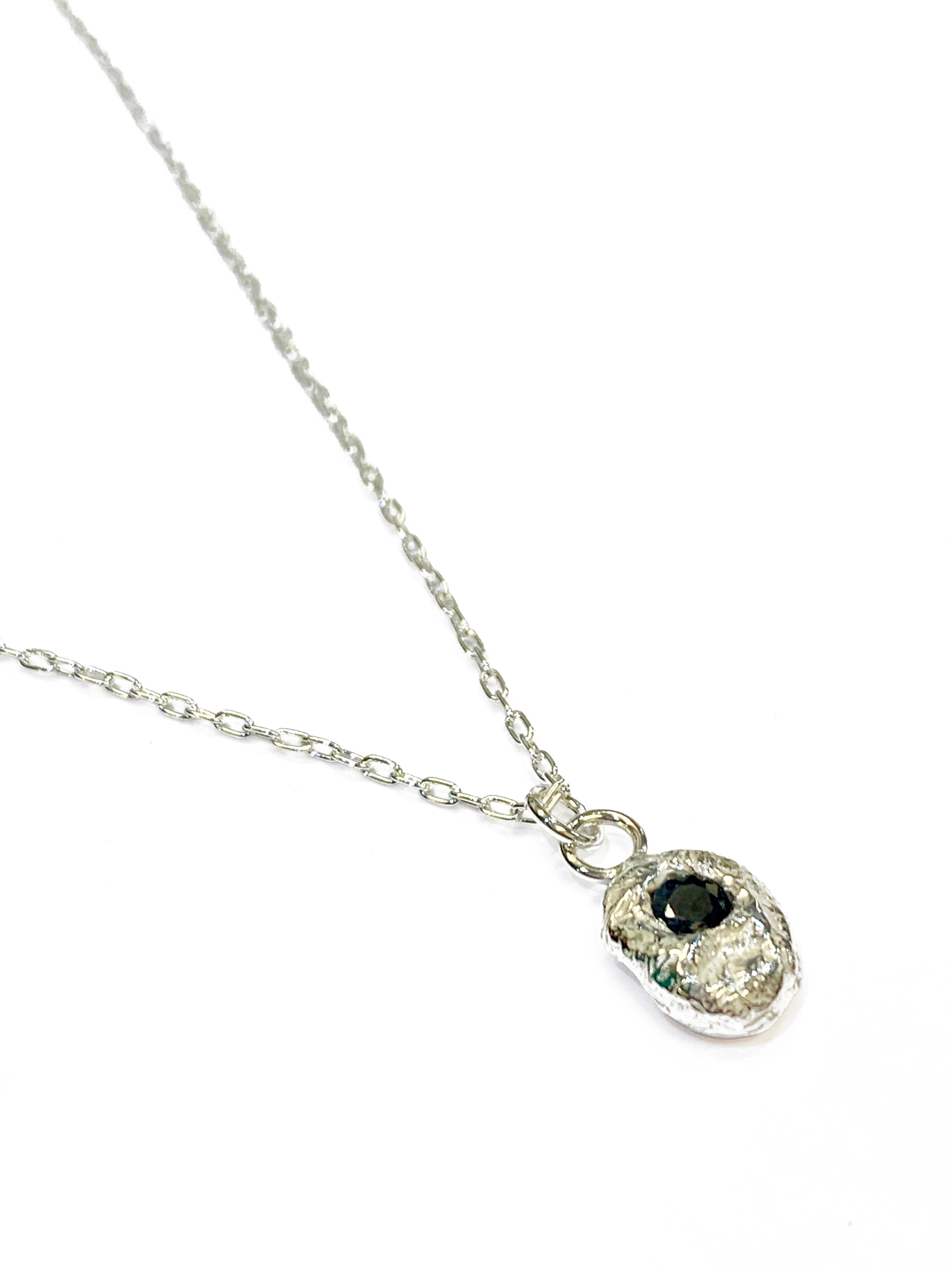 Abby Filer - Molten pendant with sapphire