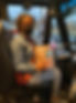 Picture of a bus driver holding a goodie bag and a bottle of water