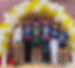 Students under a balloon arch