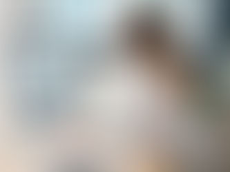 Content marketer writing on a computer in an office