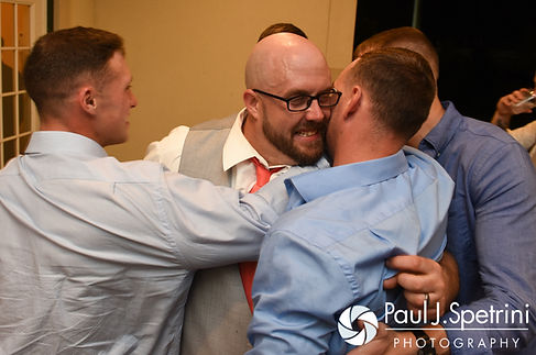 Eric hugs friends during his May 2016 wedding at Hillside Country Club in Rehoboth, Massachusetts.