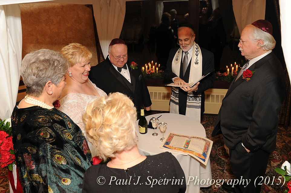 The veil ceremony at Cathy and Ron's December 2015 wedding at Quidnessett Country Club in North Kingstown, Rhode Island.
