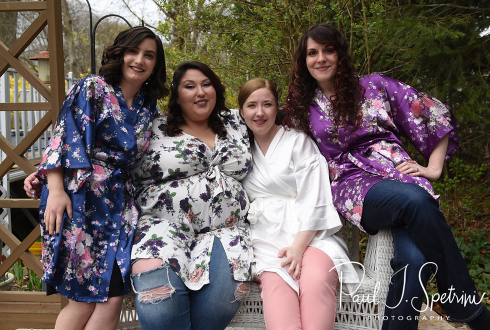 Kaytii and her bridesmaid smile for a photo prior to her May 2018 wedding ceremony at Meadowbrook Inn in Charlestown, Rhode Island.
