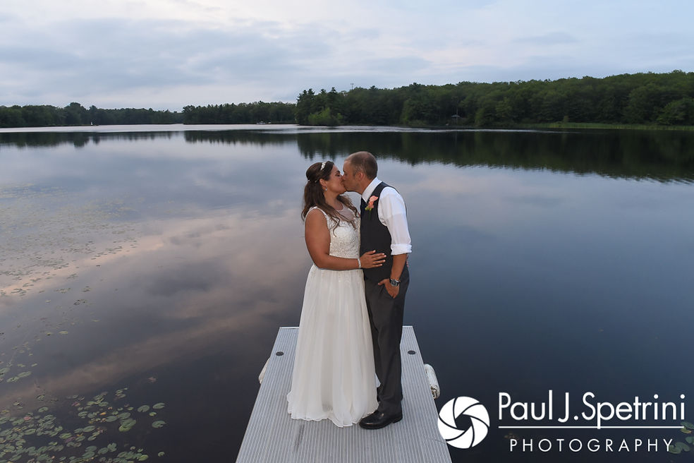 Toni and Scott pose for a photo on the dock during their August 2017 wedding reception at Crystal Lake Golf Club in Mapleville, Rhode Island.