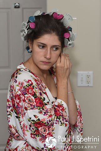 Marissa puts on her earrings prior to her September 2016 wedding ceremony at Beavertail Lighthouse in Jamestown, Rhode Island.