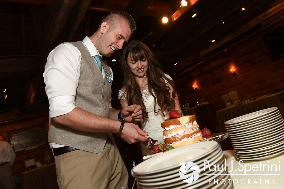 Krystal and Ian cut the cake during their May 2016 wedding reception at DeWolf Tavern in Bristol, Rhode Island.