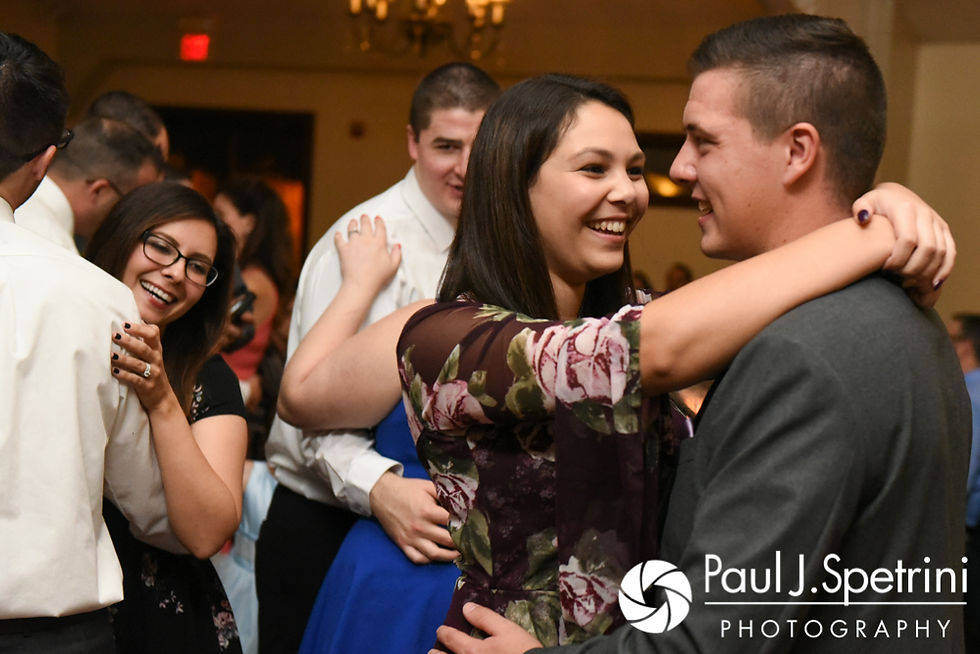 Guests dance during Kevin and Joanna's October 2017 wedding reception at Cranston Country Club in Cranston, Rhode Island.