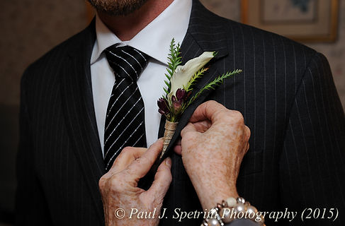 Mike has his flower adjusted prior to his November 2015 wedding at the Publick House in Sturbridge, Massachusetts.