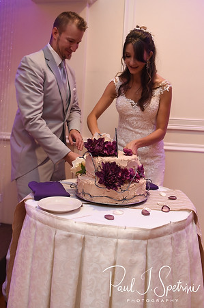 Beth & Bryan cut their wedding cake during their August 2018 wedding reception at McGovern’s on the Water in Fall River, Massachusetts.