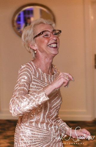 Guests dance during Laura & Marijke’s June 2018 wedding reception at Independence Harbor in Assonet, Massachusetts.