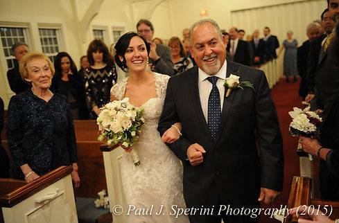 Emma and her father walk down the aisle during her November 2015 wedding at the Publick House in Sturbridge, Massachusetts.