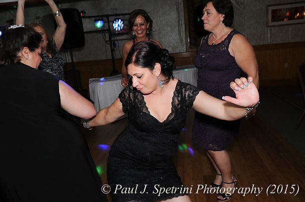 Guests dance during the wedding reception of Justin and Jamie Bolani in June 2015 in Bristol, Rhode Island.