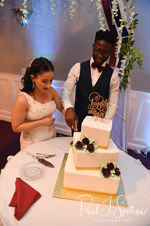 Courtnie and Richardson cut their wedding cake during their August 2018 wedding reception at Emerald Hall in Abington, Massachusetts.