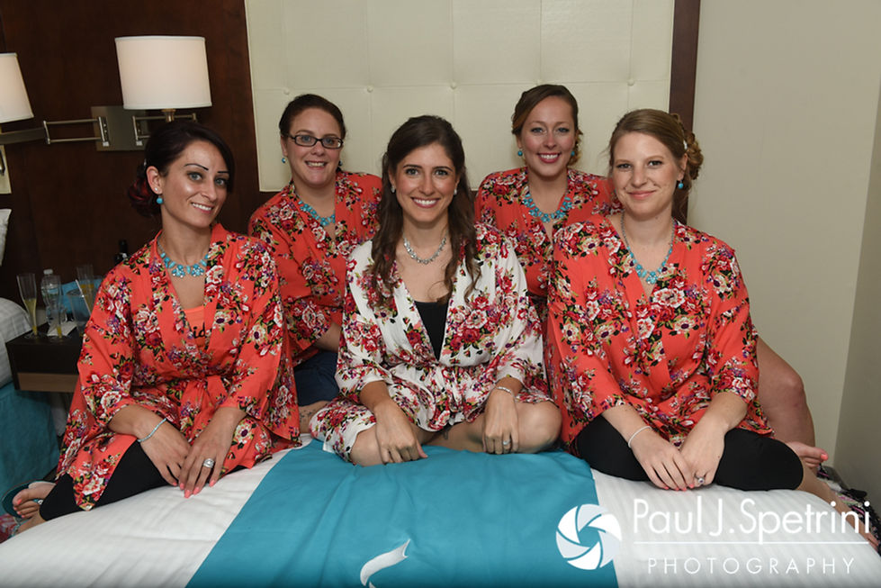 Marissa and her bridesmaids smile for a photo prior to her September 2016 wedding ceremony at Beavertail Lighthouse in Jamestown, Rhode Island.