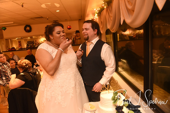 Gunnar & Aileen cut their wedding cake during their December 2018 wedding reception at McGoverns on the Water in Fall River, Massachusetts.