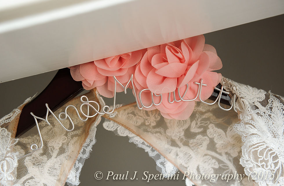 A look at the hanger used by Emma to hold her wedding dress prior to her November 2015 wedding at the Publick House in Sturbridge, Massachusetts.