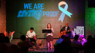 Peritoneal carcinomatosis survivor performing at Living Proof