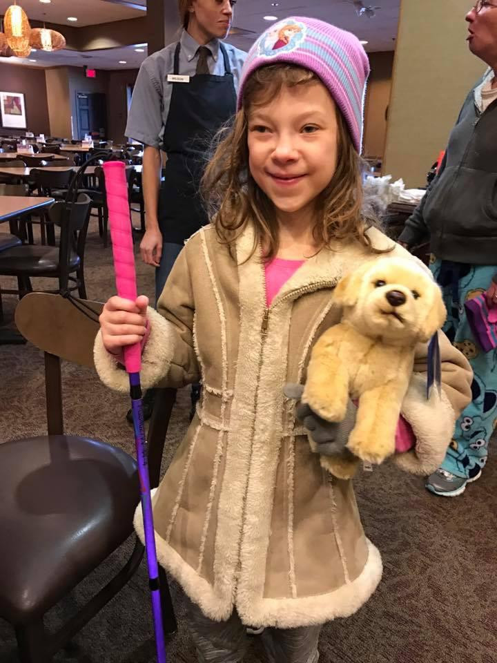 PD: This is a photo of our friend Hallie. Kristin gave her a new pink and purple cane a few years ago that she named bubbles. She is also holding a seeing eye stuffed animal.