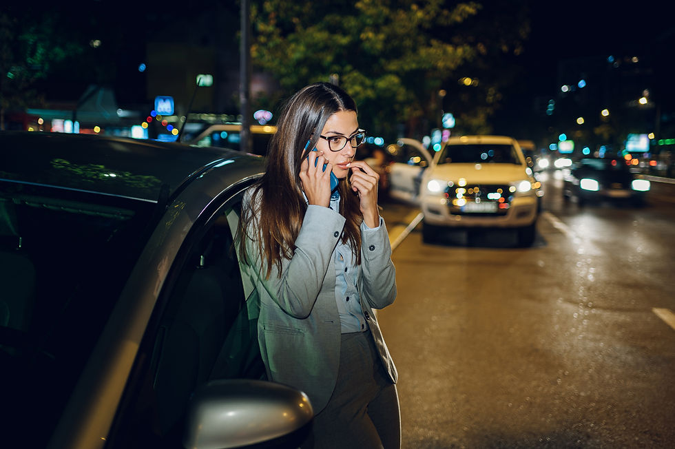 Woman alone broken down on the side of the road at night